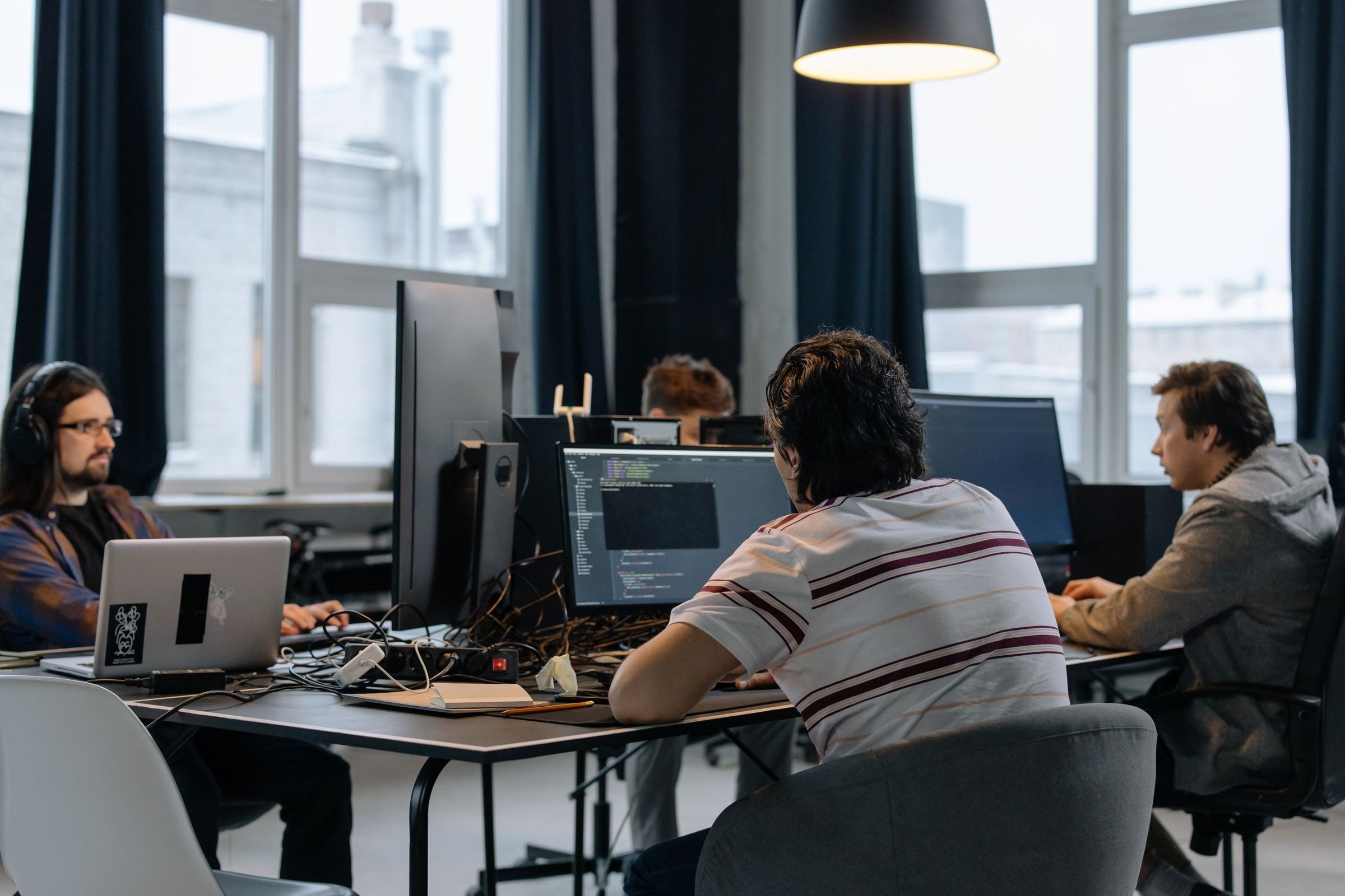 A software team working at their monitors in an office
